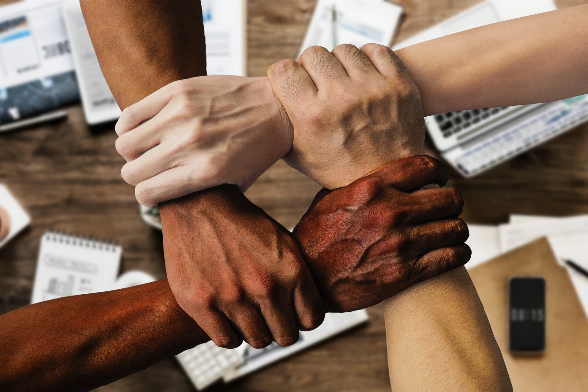 Hands joined together in partnership